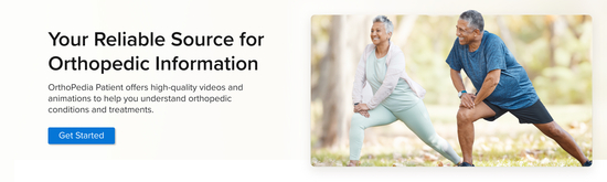 Photograph of an older-aged woman and man wearing athletic clothes and performing leg stretches outside. They are both smiling.