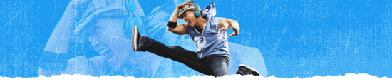 Man in a hat and headphones excitedly jumping in the air