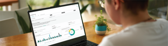 Person navigating their Analytics 2.0 dashboard in Mindbody software