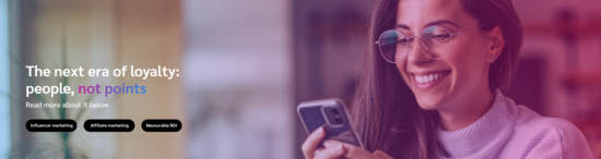 Header image with purple gradient and a woman smiling at her phone, featuring the headline "The Next era of loyalty: people, not points"