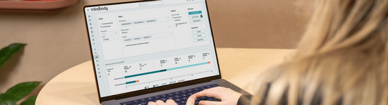 Image of a laptop screen featuring the Mindbody software.